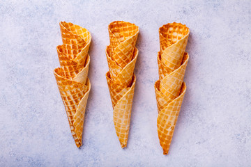Waffle ice cream cone on a light background