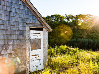 sun shining on old shack