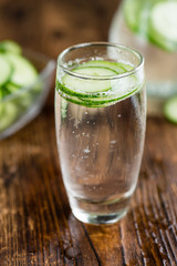 Cucumber Water on vintage wooden background