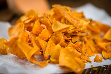 Portion of Sweet Potato Chips , selective focus
