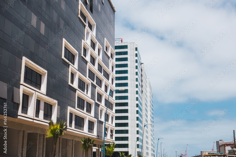 Wall mural Low angle view of modern buildings against sky in Casablanca - Morocco