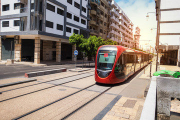 a tram passing on the railway in a sunny day - Casablanca - Morocco