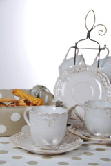 Tasty fresh buns with granny's tea in a retro cup