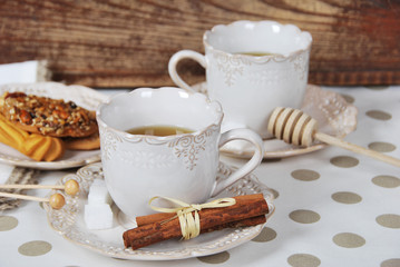 Tasty fresh buns with granny's tea in a retro cup