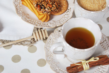 Tasty fresh buns with granny's tea in a retro cup