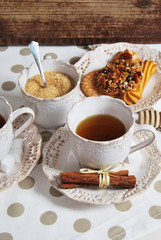 Tasty fresh buns with granny's tea in a retro cup