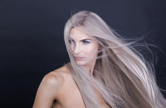 Portrait Of A Girl With Flying Long Grey Hair