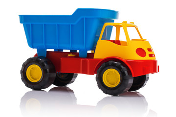 Baby beach sand toys and colorful plastic truck isolated