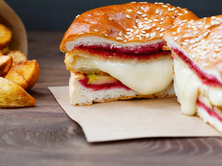 Burger with Camembert cheese and cowberry sauce