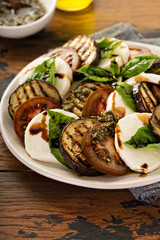Summer caprese salad with grilled eggplant