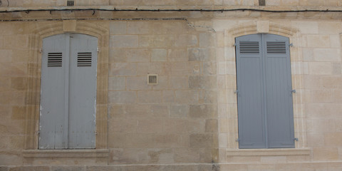 wash cleaned house facade and a dirty one in a city town, before and after