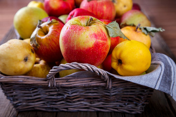 Fresh apples in a basket on an old wooden background.Food or Healthy diet concept.Super Food.Vegetarian.selective focus.Vintage style.