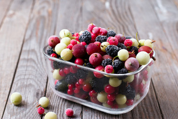 Frozen berries on a wooden table