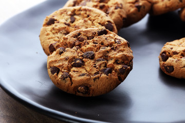 Chocolate cookies on wooden table. Chocolate chip cookies shot