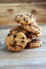 Chocolate cookies on wooden table. Chocolate chip cookies shot