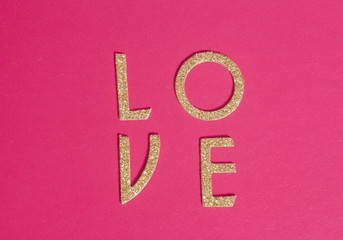 Shiny golden letters forming the word love