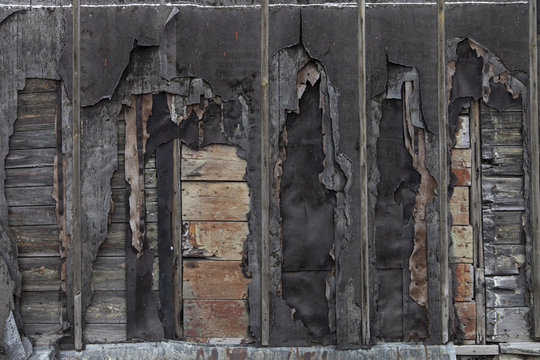 Old torn black house wall