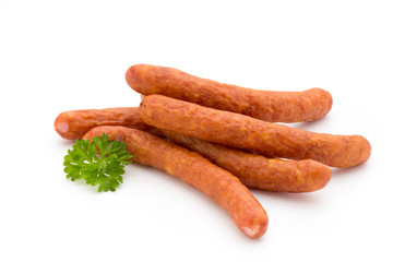 Stack of smoked sausages isolated on a white background.