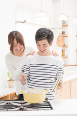 portrait of young asian couple in kitchen