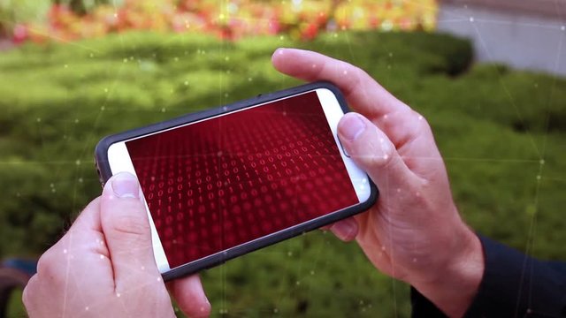 Technology Concept - A Mans phone infected with Malware over the internet