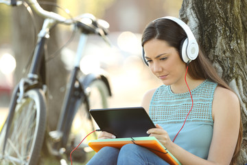 Student e-learning with tablet and headphones