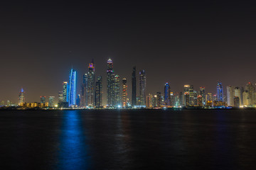 Dubai Marina night skyline from Palm Jumeirah promenade, UAE United Arab Emirates