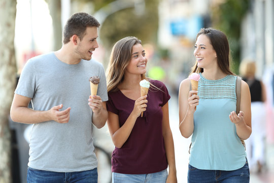 Friends Talking And Eating Ice Creams