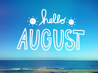 Hello August word on beach and blue sky