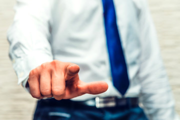 Finger of businessman show you. Businessman wear white shirt and blue. Male selects someone for project, job