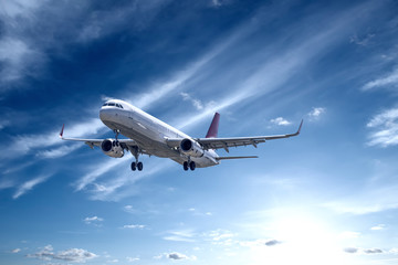 Fototapeta na wymiar Airplane with beautiful sky on background