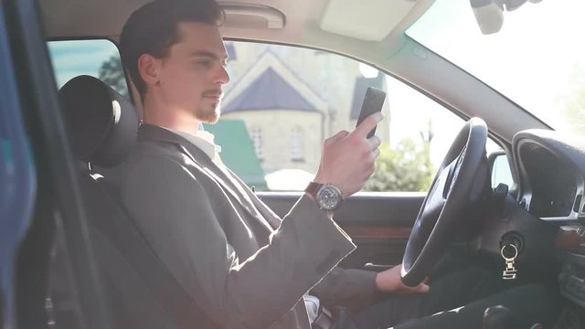 lawyer doctor manager senator major head lead CEO executive director focusing on work. Handsome young man working on his smartphone slow motion