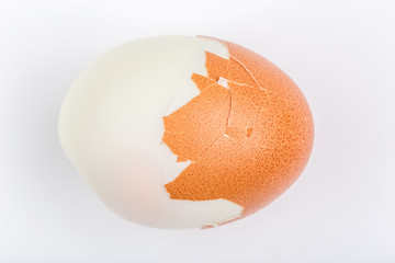 Peeled hard shell boiled egg isolate on white background.