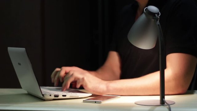 Man Uses Laptop And Come In Of The Shot