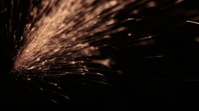 Sparks fly out of the darkness. Screensaver or element for special effects. Black color instead of green background.