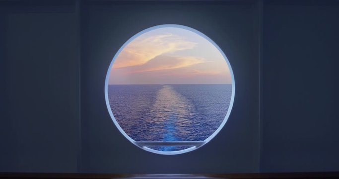 Static shot looking out at the open ocean and wake from a cruise ship's porthole.  	