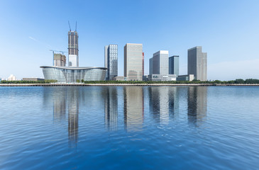 Dalian city waterfront downtown skyline with Haihe river,China. - obrazy, fototapety, plakaty