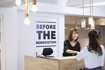 Women are working at reception desk