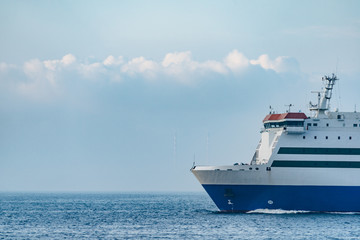 an industrial ship cruising on bohai ocean against blue sky,dalian city,china.