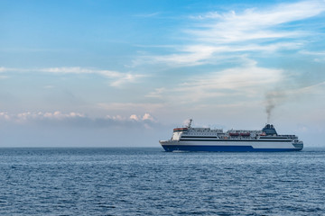 Fototapeta na wymiar an industrial ship cruising on bohai ocean against blue sky,dalian city,china.