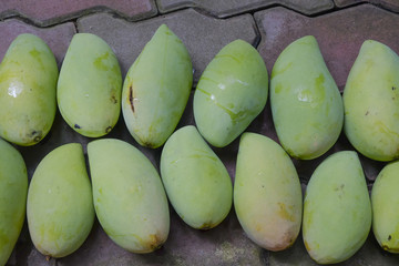 mangoes on cement floor