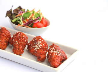 Bonchon Chicken spicy and sweet taste on white table.