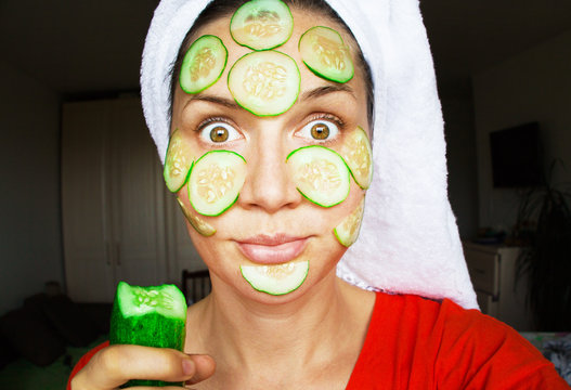 A Girl In A Mask Of Cucumbers