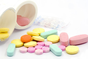 multicolor medical tablets  on white background