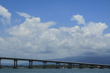 Fototapeta na wymiar The Bridge across the sea and blue sky in Thailand