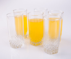 Orange juice in glasses on white background.