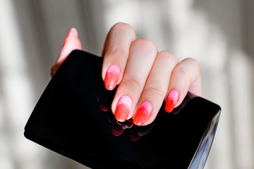 Red and pink ombre manicure, hand with pretty pastel nails, care for hands © T.Den_Team