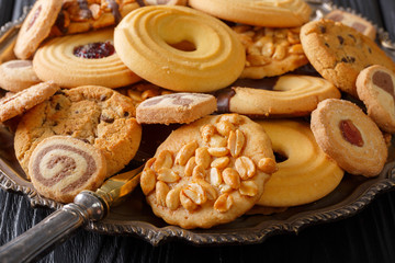 Delicious cookies in assortment with various fillings close-up, horizontal