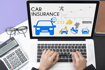 business hand using computer with car insurance policy page. concept accident prevention coverage.