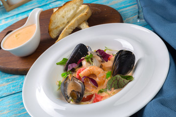 Tasty seafood on plate on table close-up