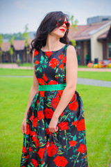 Elegant beautiful woman in vintage dress walking on European town in square and pleasure the life. Perfect style and luxury life of 50s and woman look like a doll